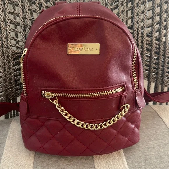 bebe red mini backpack Mini BEBE backpack with gold details
